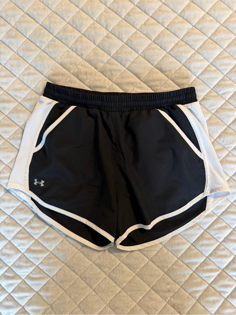 Under Armour black and white athletic shorts with pockets